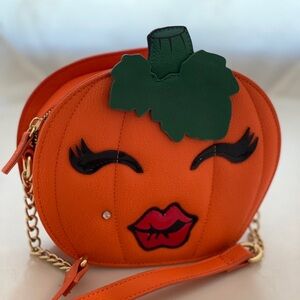 Betsy Johnson pumpkin purse with Monroe rhinestone piercing